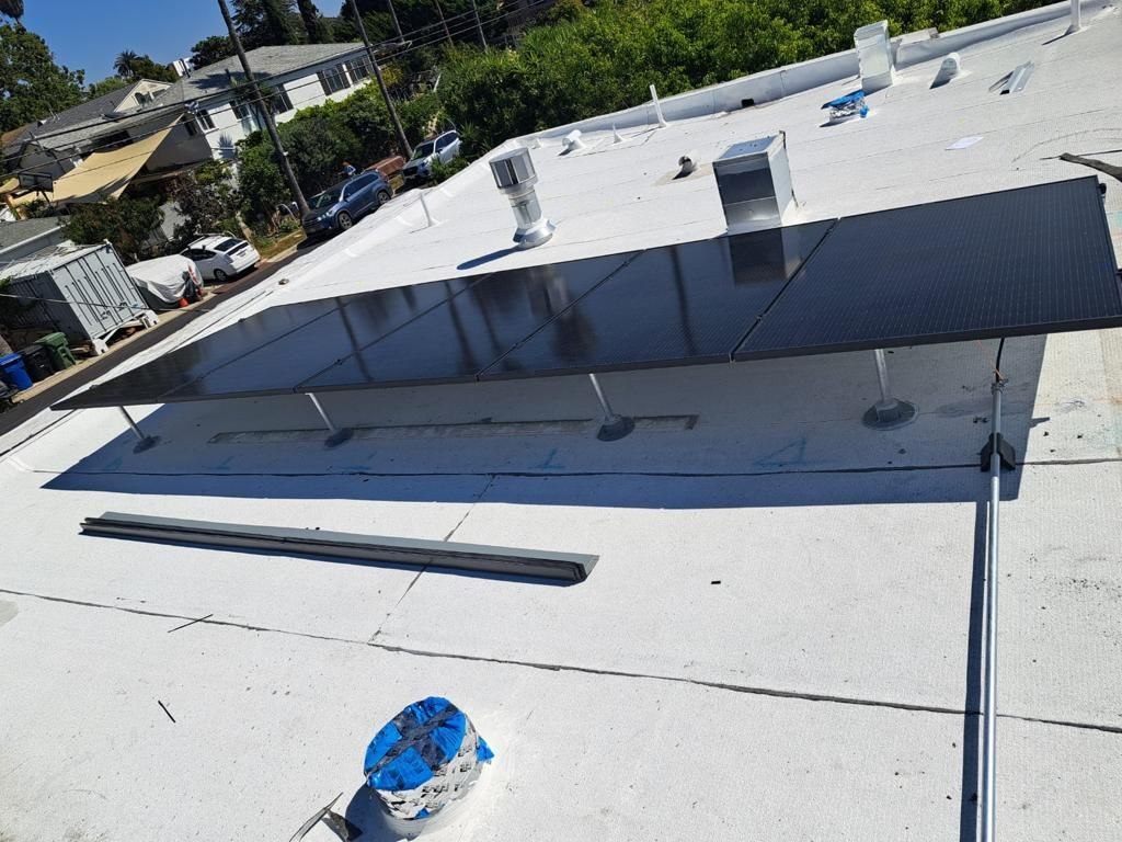Tilt-mount solar array with residential Los Angeles neighborhood context — solar-integrated build by PBG.