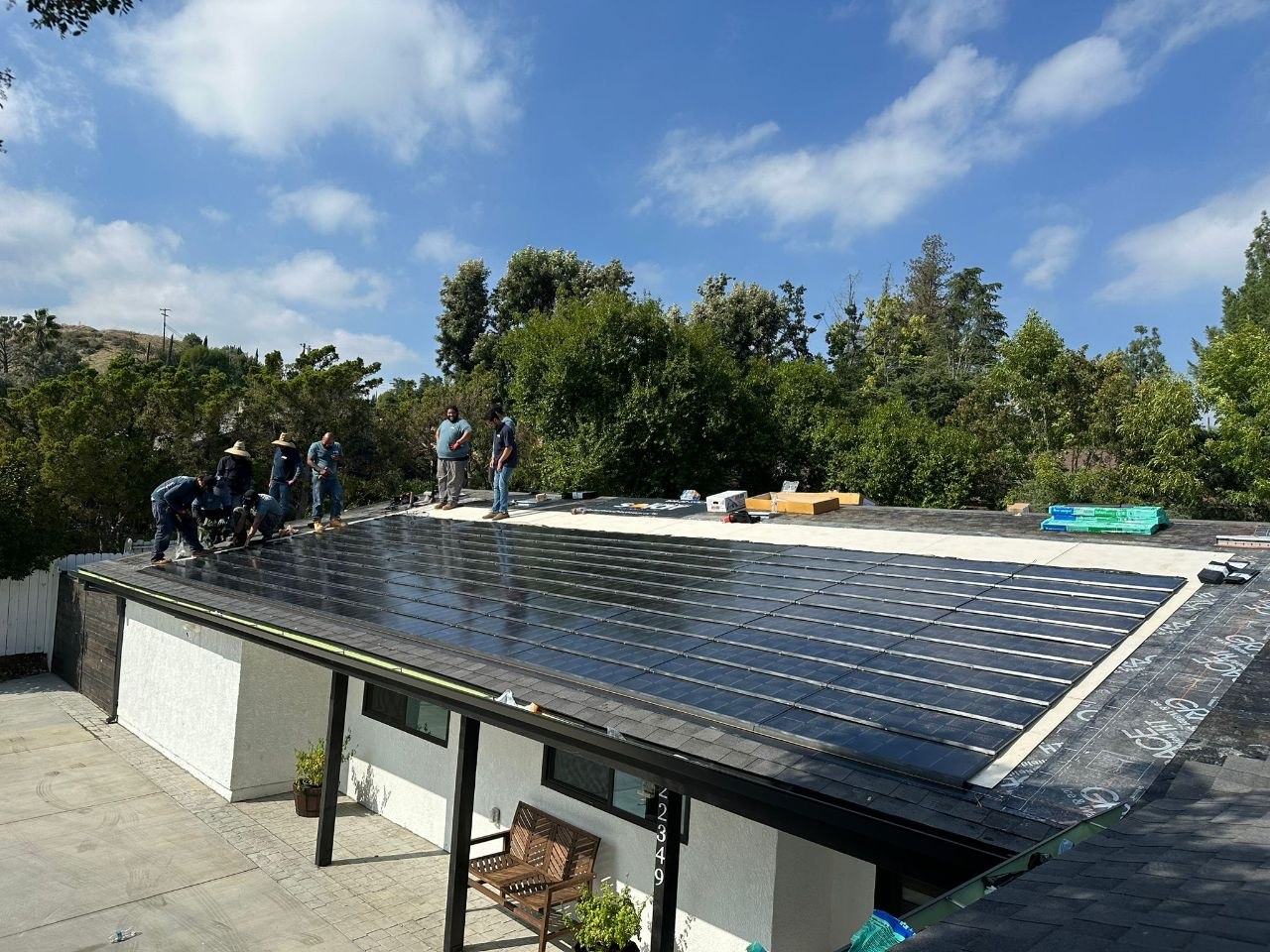PBG crew installing solar shingle roof on a low-slope residential build — Los Angeles.