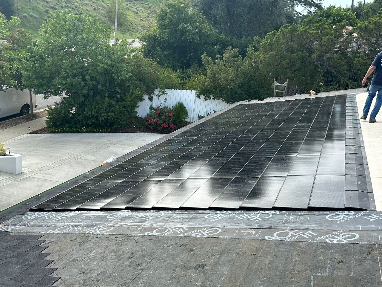 Close-up angled view of installed solar shingles over Grace Ice & Water Shield underlayment — PBG craft detail, Los Angeles.