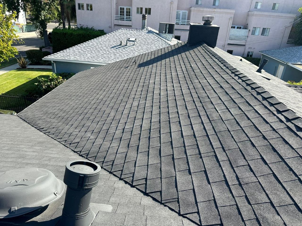 Finished BIPV (building-integrated photovoltaic) roof — looks like a premium shingle, is all solar — on a PBG custom residential build, Los Angeles.